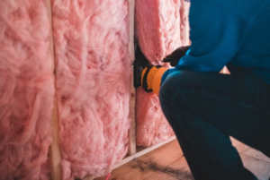 a home builder installing home insulation