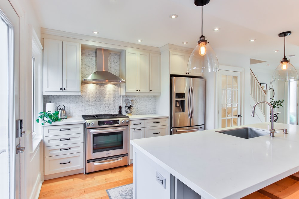 A Kitchen With White Cabinets