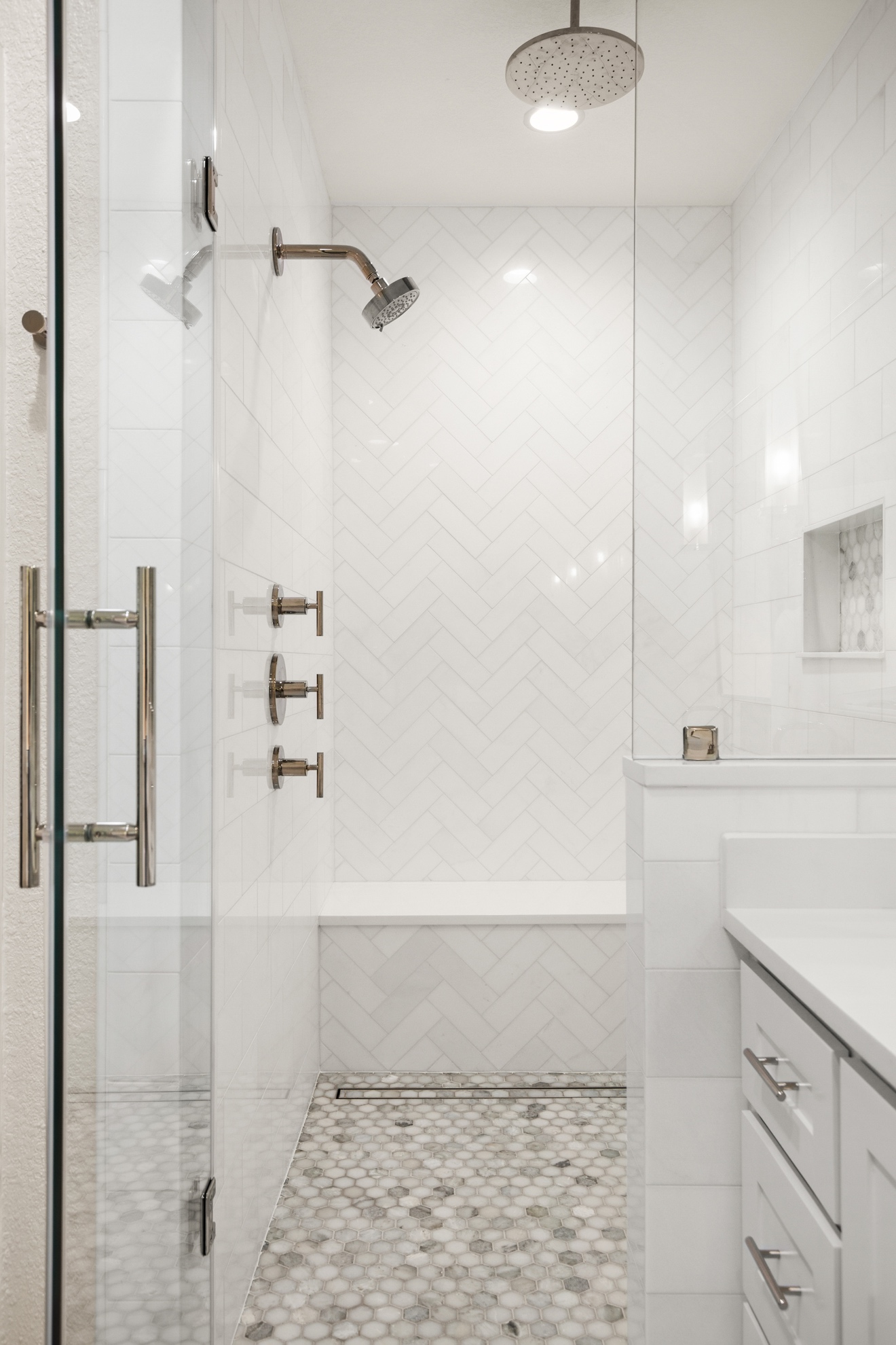 Walk-in shower with marble bench