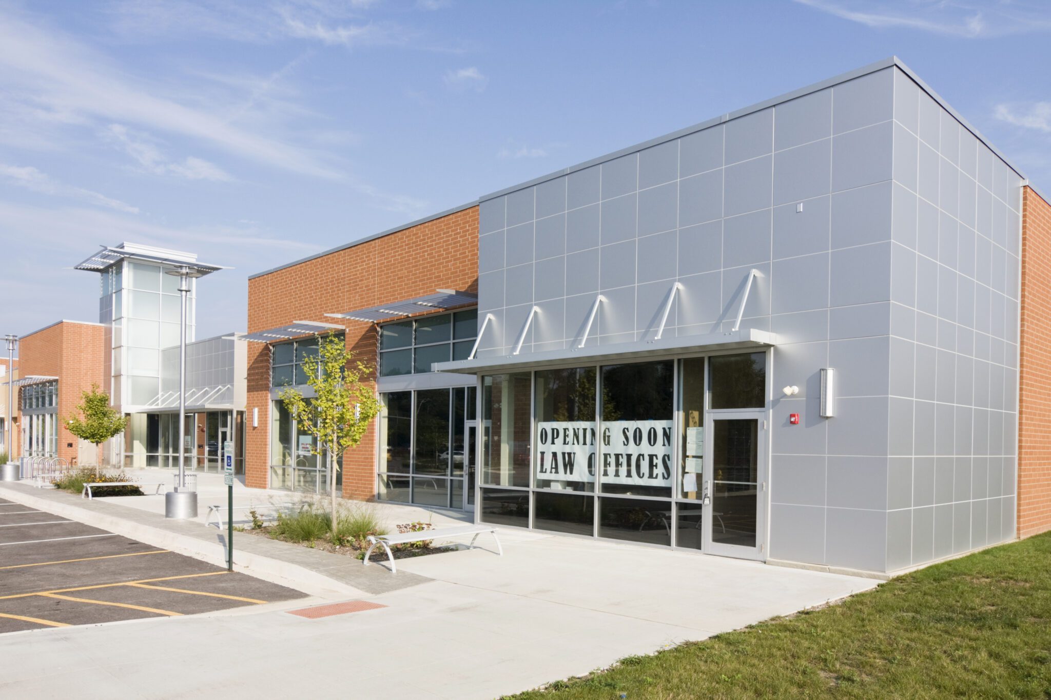 Newly built orange and gray law office. A fully constructed commercial building.